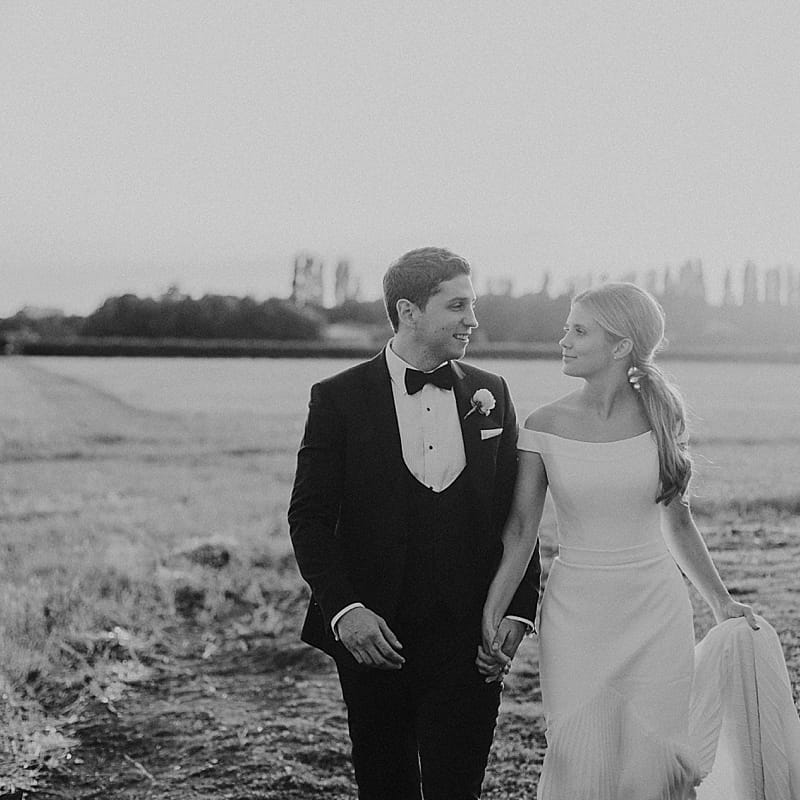 Bride in Suzanne Neville Bardot Nouveau Wedding Dress | Groom in Black Tie | Pastel Pink &amp; Mint Green Wedding at Granary Estates Suffolk | Julia &amp; You Photography