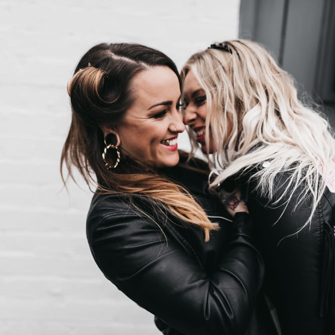 Intimate portrait of Rock n Roll brides in leather coats
