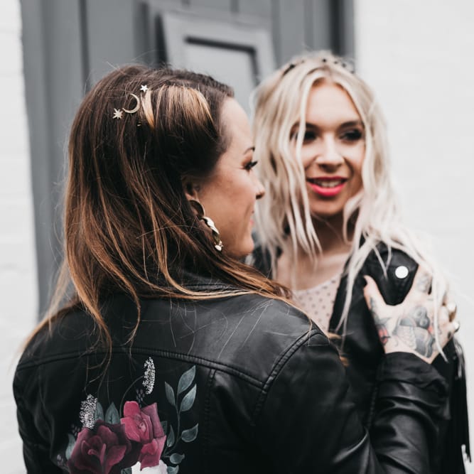Alternative bride with tattoos and leather jacket