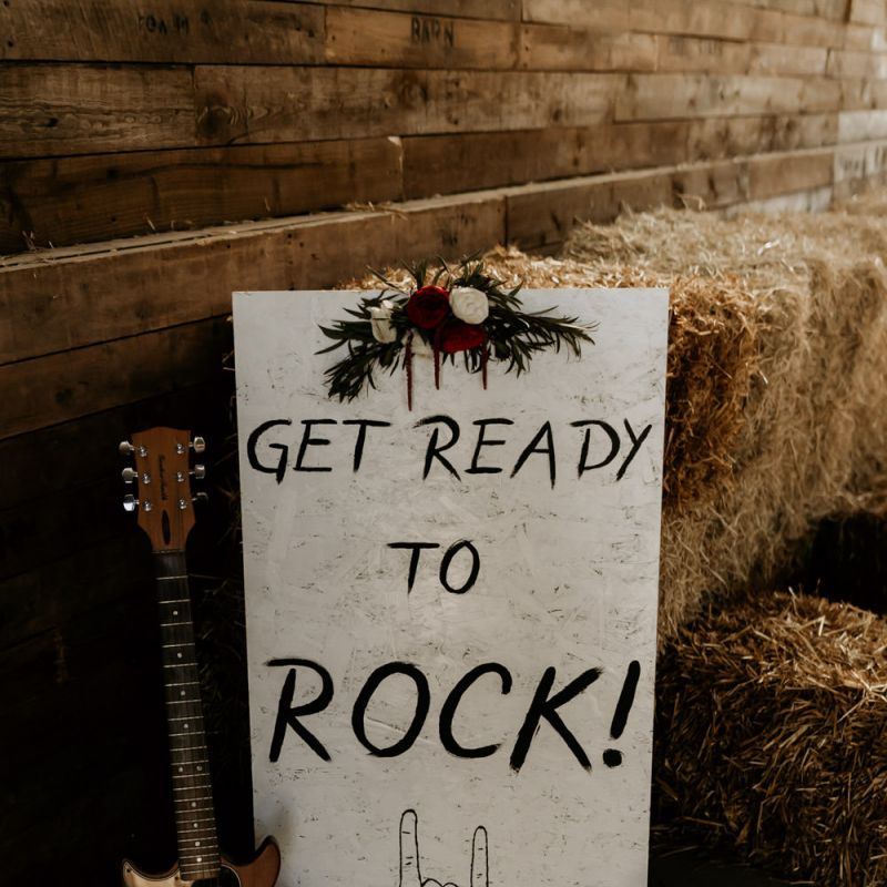 Get Ready to Rock Wedding Sign with Guitar and Hurricane Vase Decor