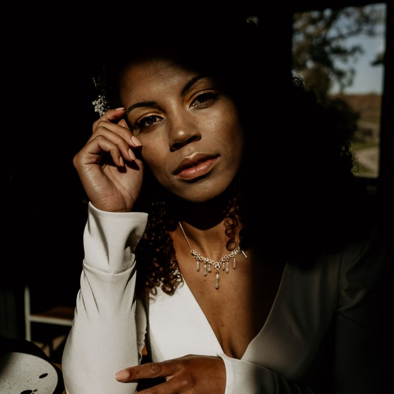 Black Bride with Afro Hair &amp; Cheek Highlighter in White Jumpsuit hoot_spring2019 60