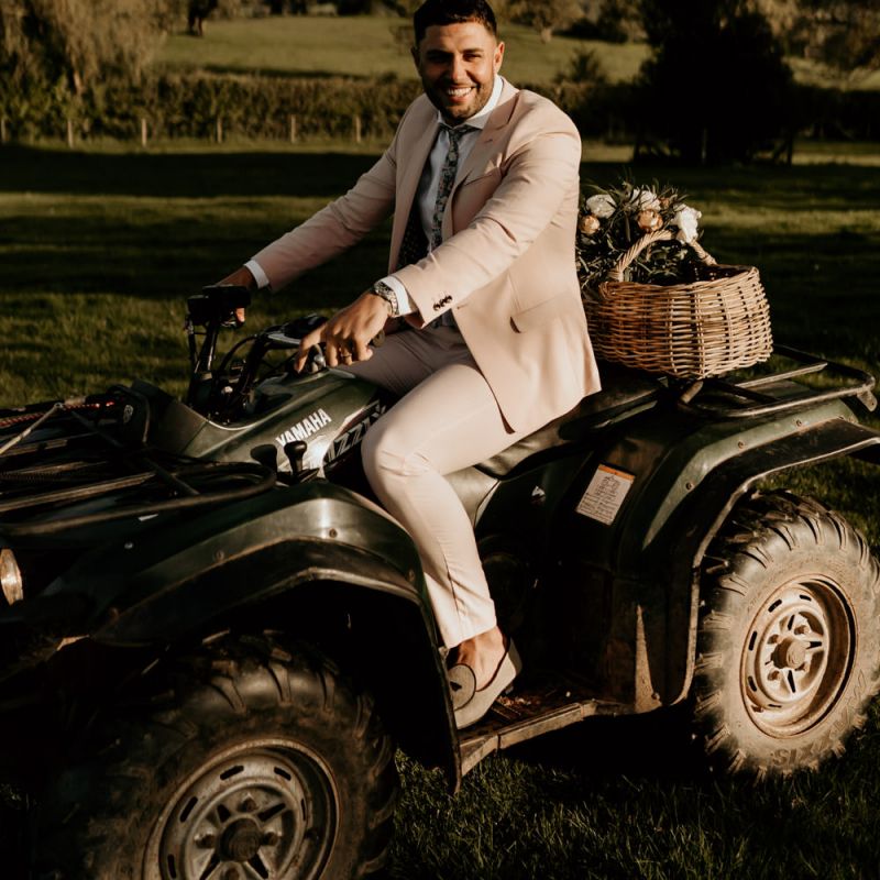 Groom in Pink Suit Riding a Quad Bike
