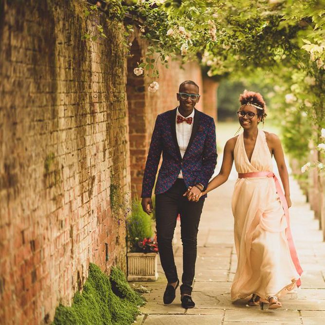 Black bride in blush wedding dress and gold headdress