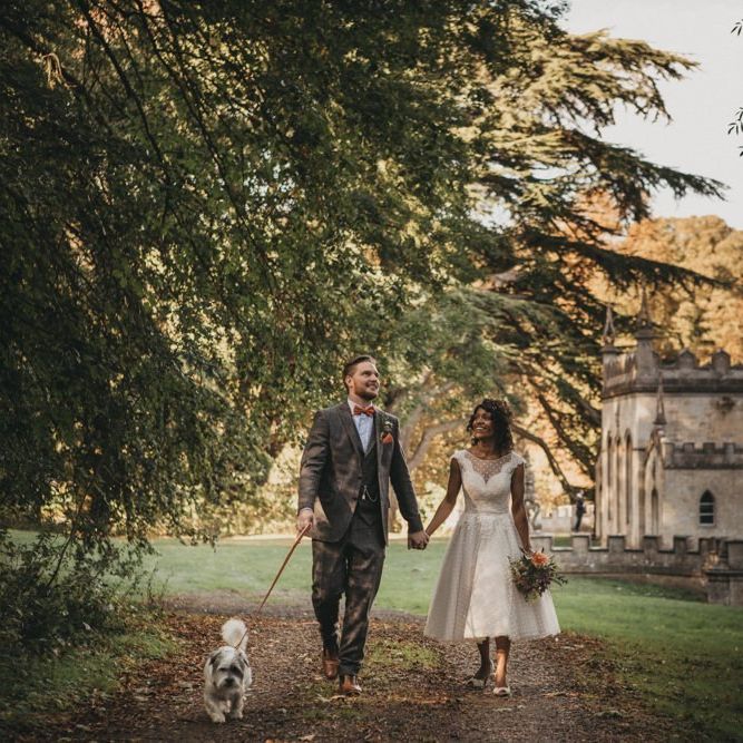 Black bride in tea length wedding dress with curly hair