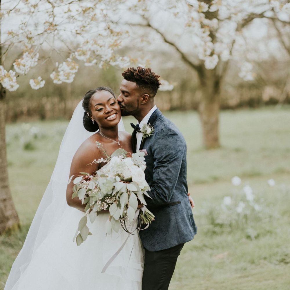 Black bride in off the shoulder wedding dress
