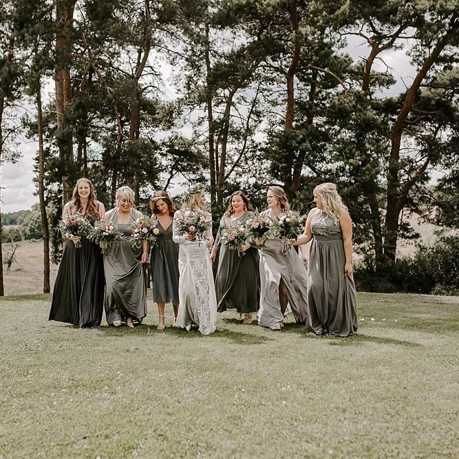 Grey bridesmaid dresses with Protea bouquet
