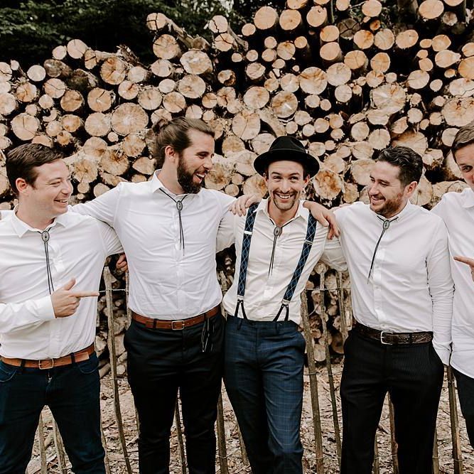 Groom and groomsmen in matching white shirts