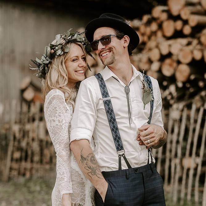 Bride and groom laugh as they pose for photos after the wedding ceremony