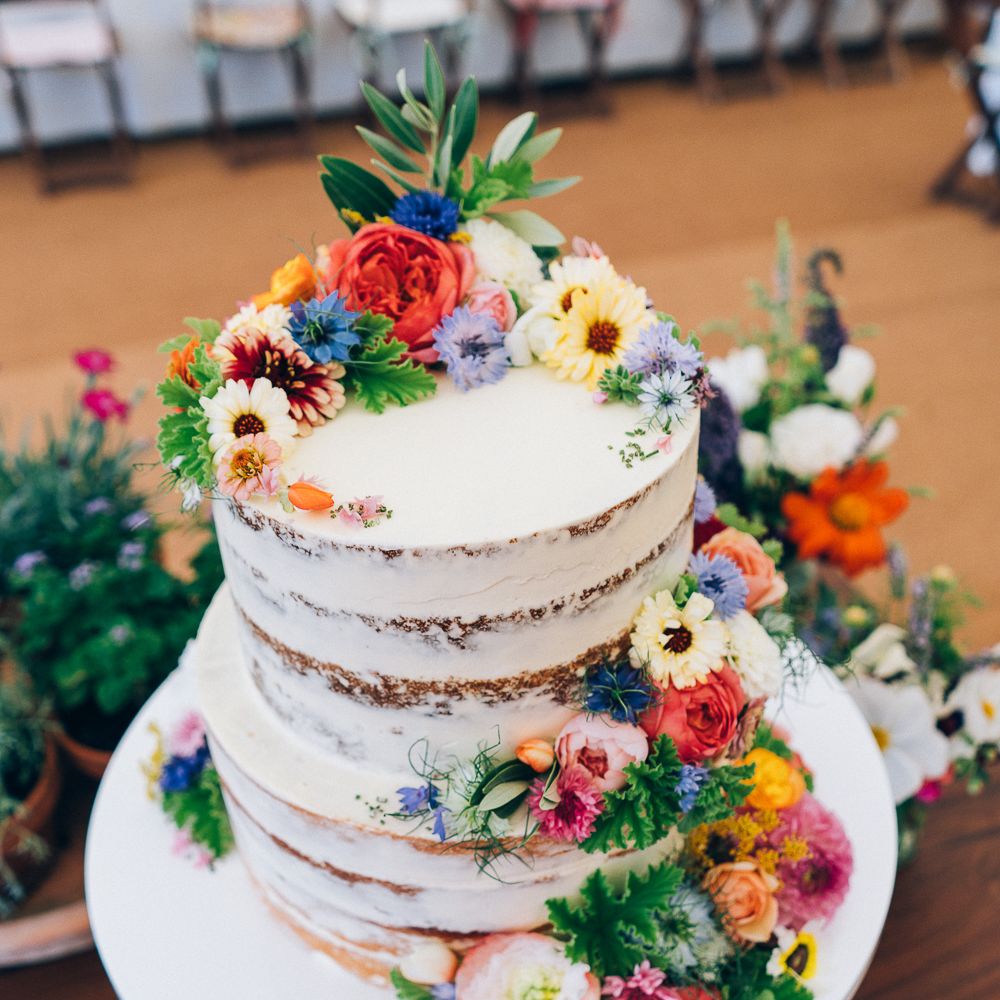 Naked Wedding Cake With Wild Flower Decor // Images By Casey Avenue Photography