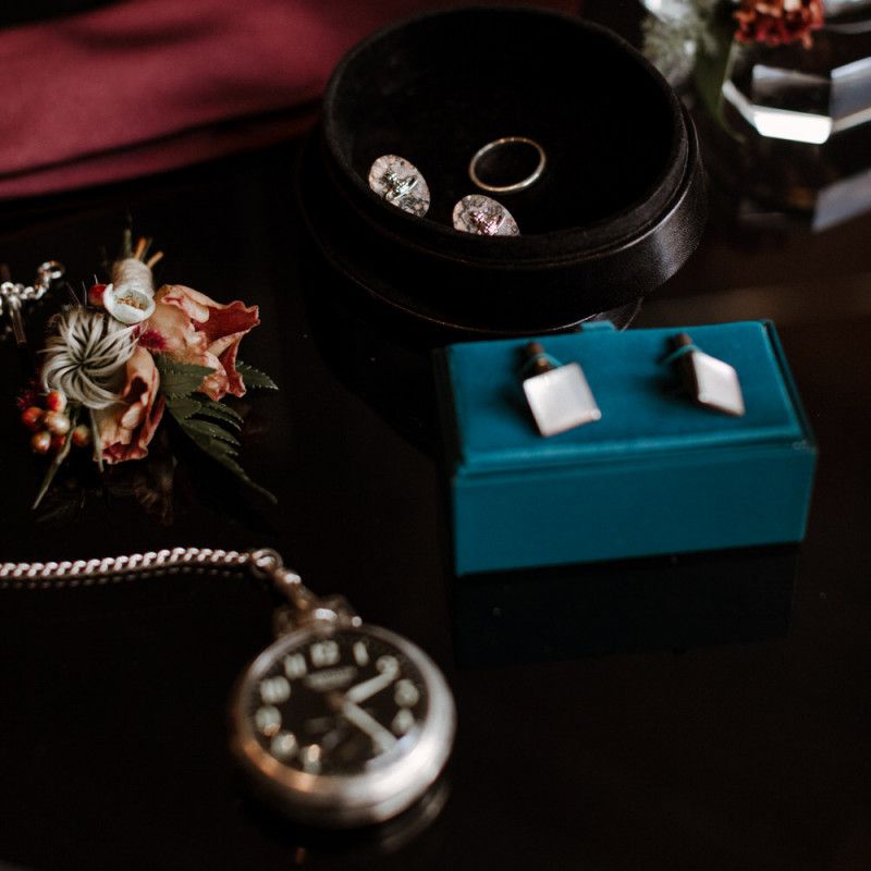 Grooms accessories with cufflinks and wedding band