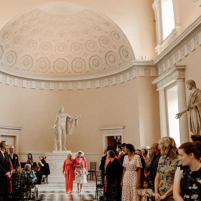 Mother of the Grooms walking down the aisle