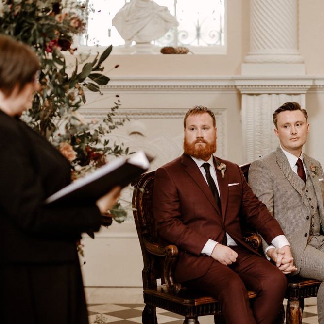 Groom and groom holding hands at Syon Park wedding ceremony