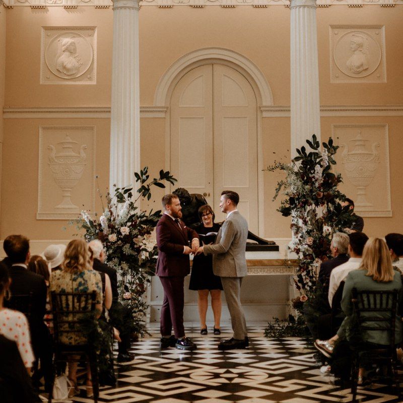 Groom and groom exchanging vows at their Syon Park wedding ceremony