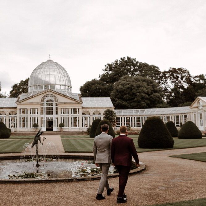 Mr &amp; Mr walking through Syon Park grounds towards the conservatory