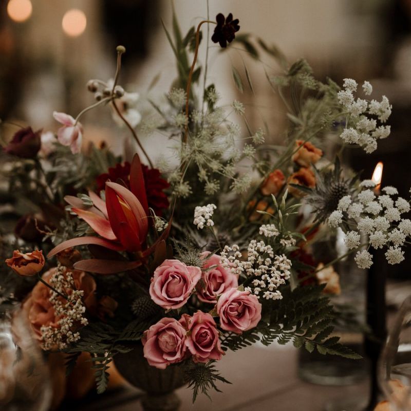 blush pink and orange autumnal wedding flower centrepieces