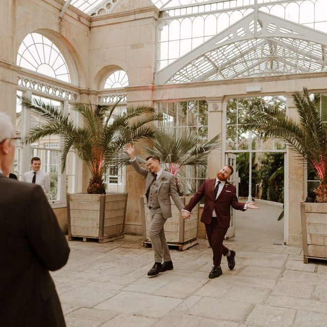 Groom and groom entering the Syon Park wedding reception