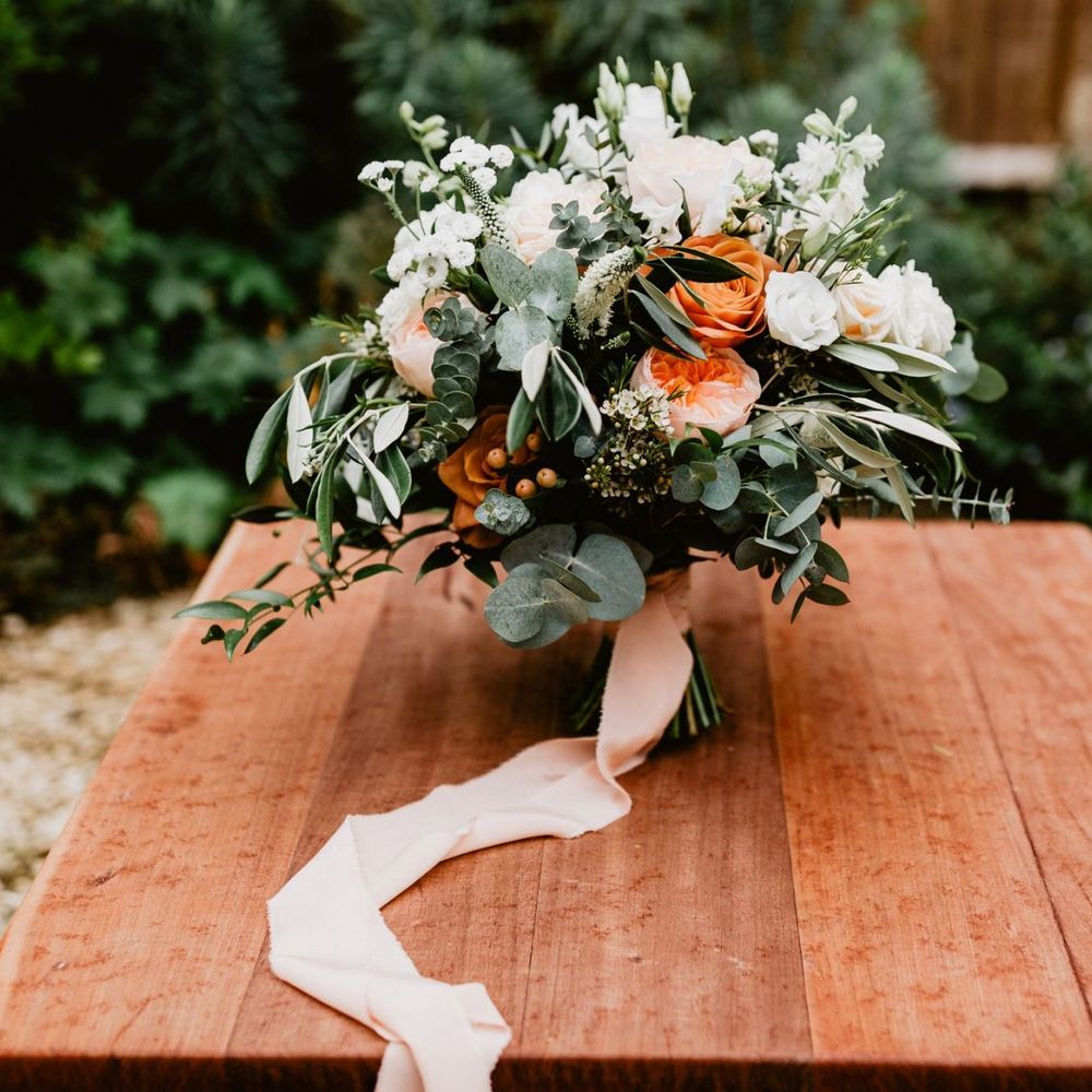 White and peach wedding bouquet tied with ribbon for 2020 wedding