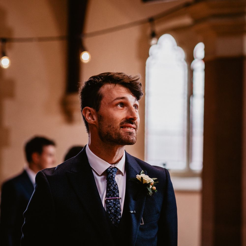 Groom standing at the altar