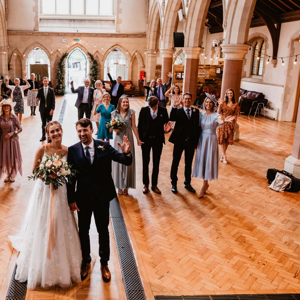 Socially distance wedding guests portrait in the church