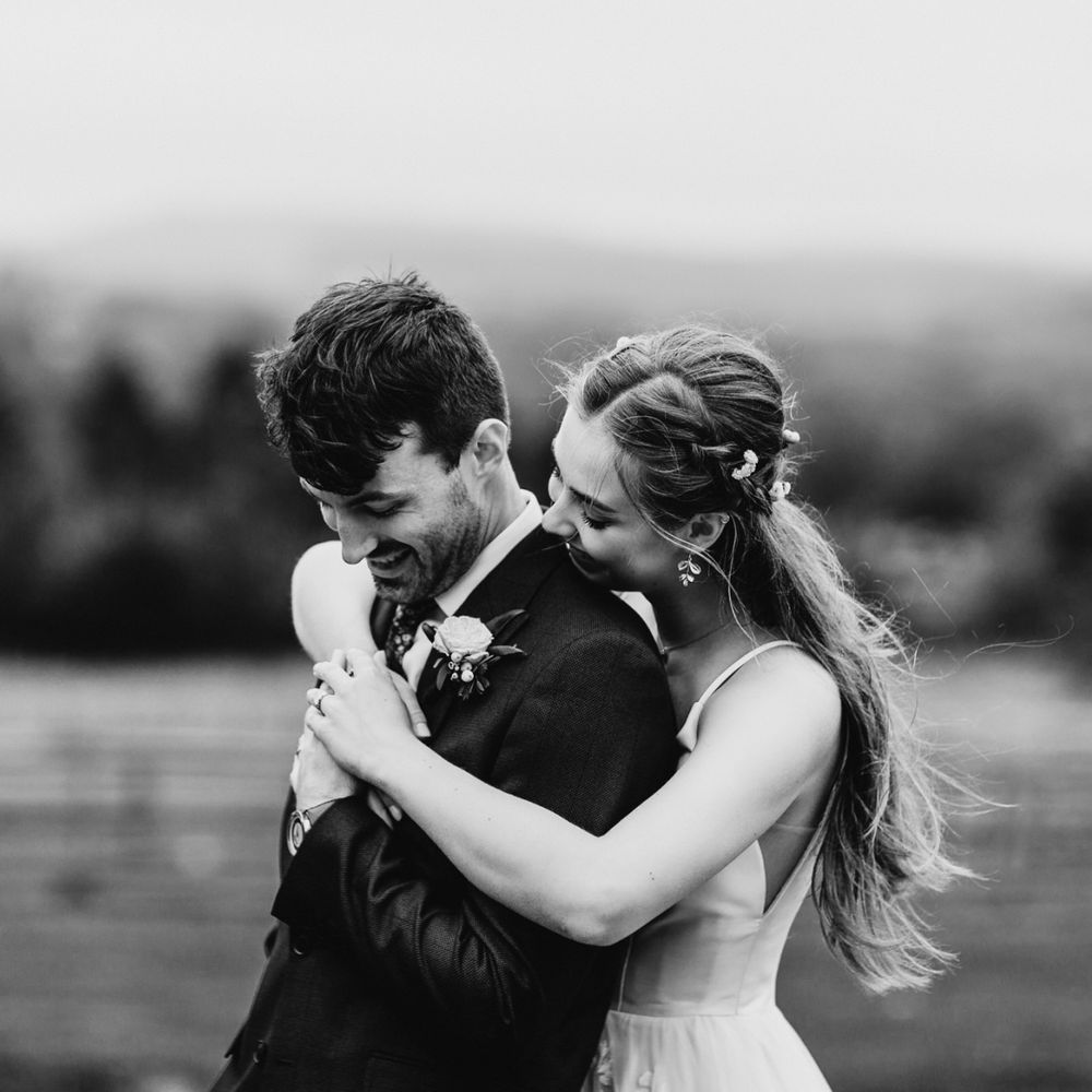Bride and groom embracing