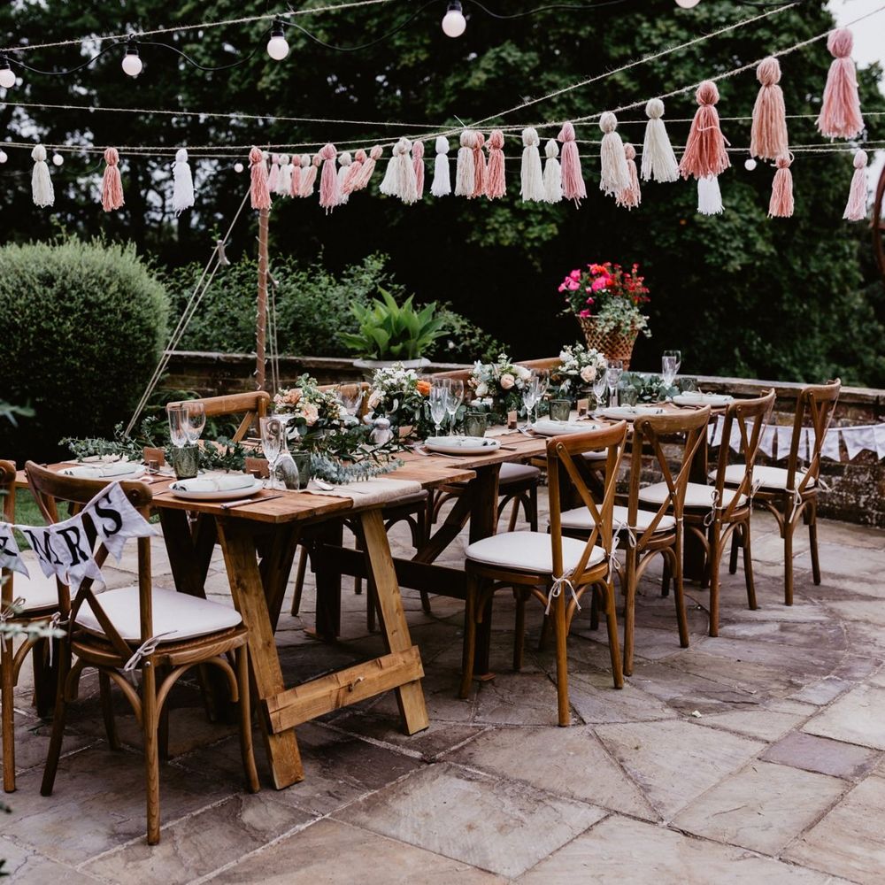 Garden party 2020 wedding reception with tassels and festoon lights
