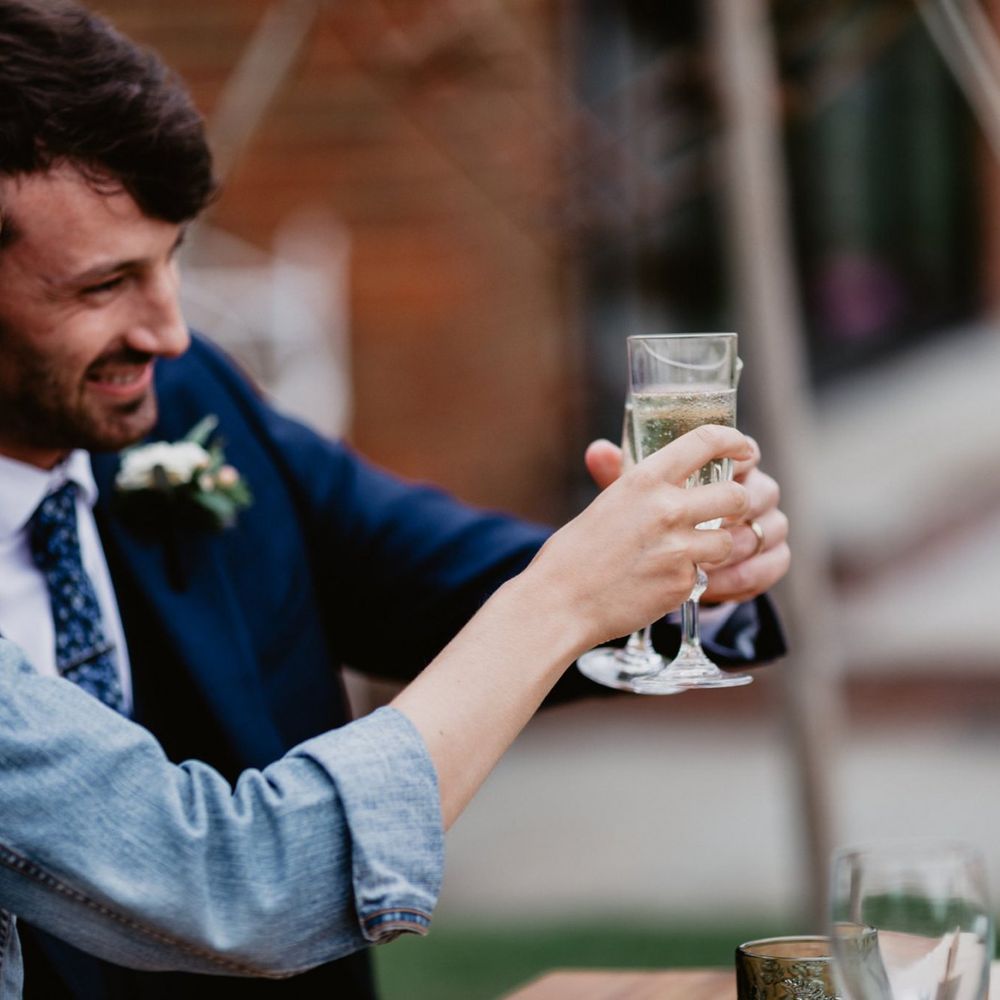 Bride and groom toasting at intimate wedding