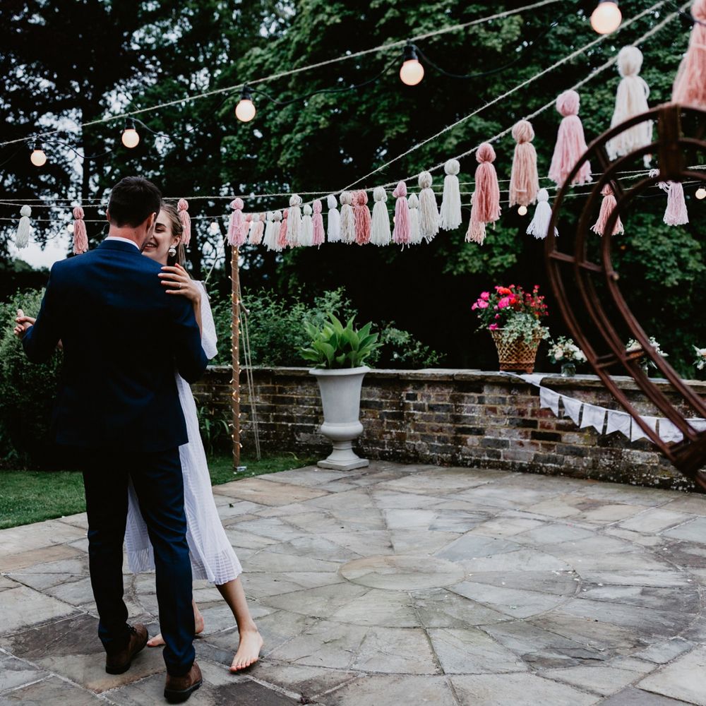 Bride and groom first dance at socially distanced  garden party reception