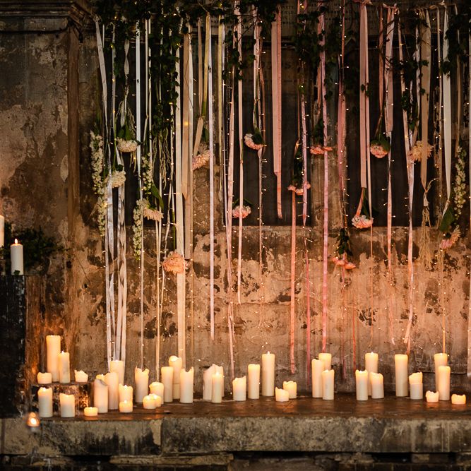 The Asylum Altar with Church Candles and Hanging Ribbon and Flowers