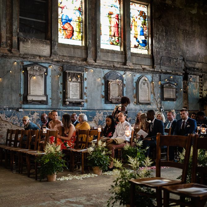 The Asylum Wedding Venue with White and Green Potted Plant Aisle Flowers