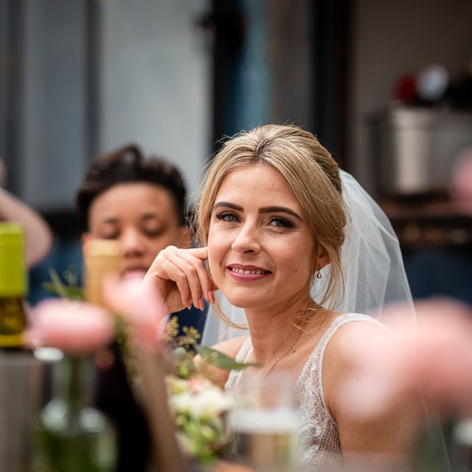 Beautiful Bride Smiling at Wedding Reception Speeches