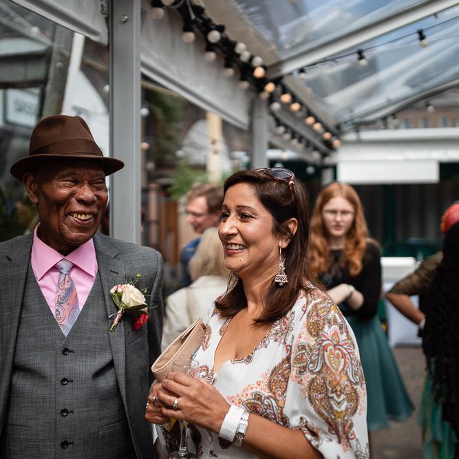 Wedding Guests Smiling During Evening Reception