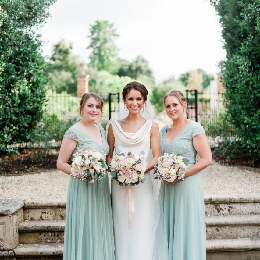 Mint green bridesmaid dresses with blush bouquets