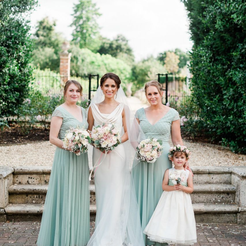 Bridesmaids and flower girl with blush bouquets
