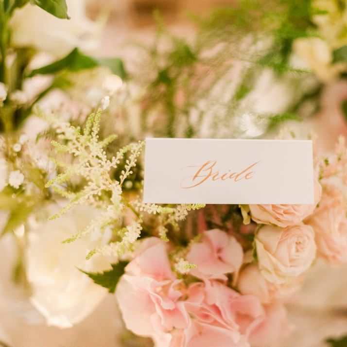 Pink wedding flowers and place setting