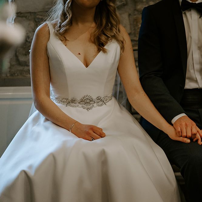 Satin wedding dress with embellished belt detail