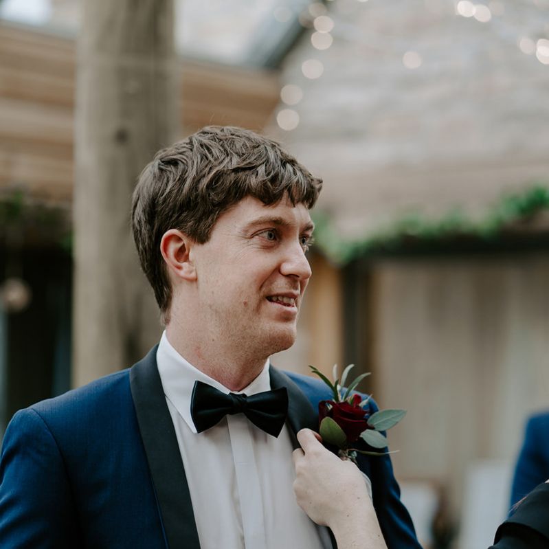 Groom in Navy blue tuxedo