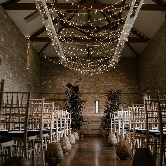 Fairy light canopy and unplugged wedding sign for ceremony