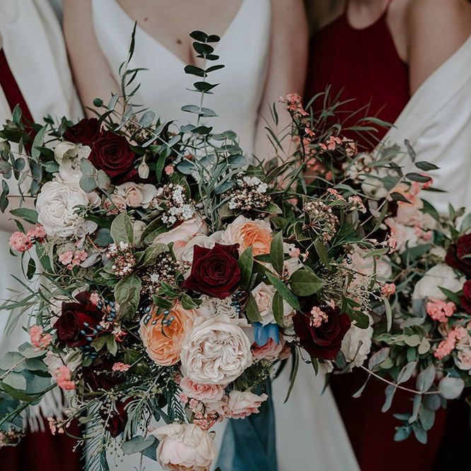Winter wedding bouquet with pinks and red flowers