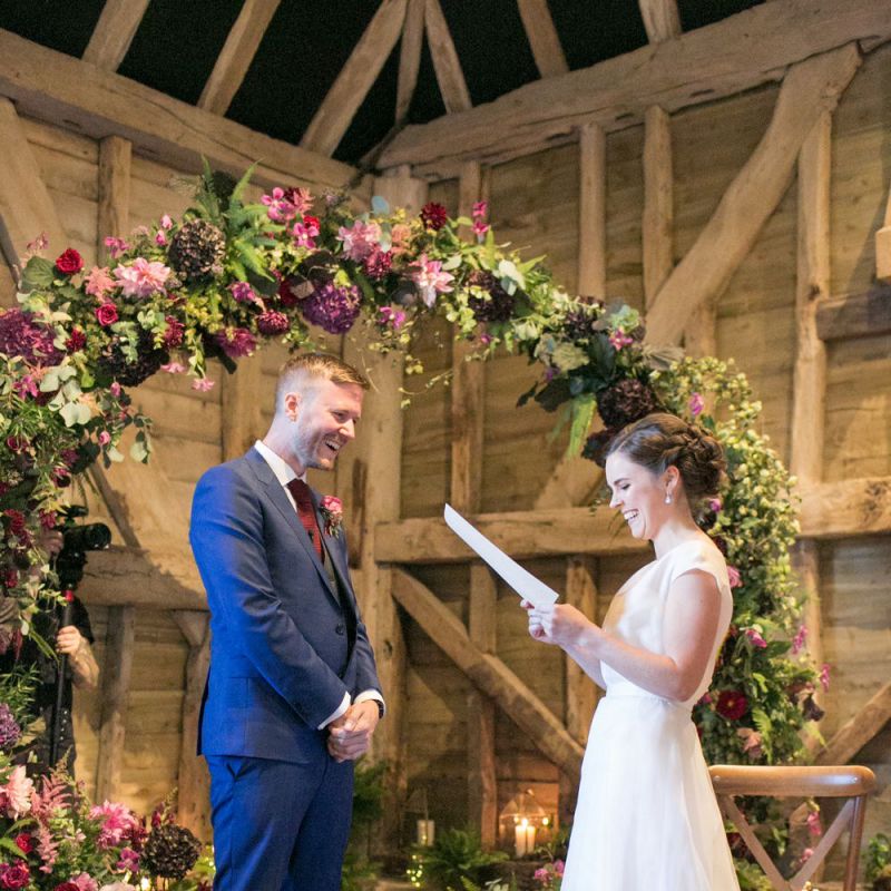 Bride in Jesus Peiro Wedding Dress and Groom in Blue  Hugo Boss Suit Saying Their Vows at The Moon Gate Altar