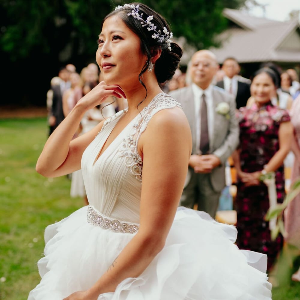 Bride in preloved wedding dress with layered skirt