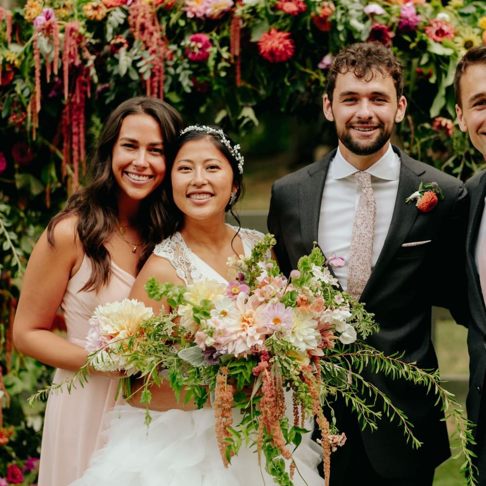 Bride and groom portrait with the best man and maid of honour