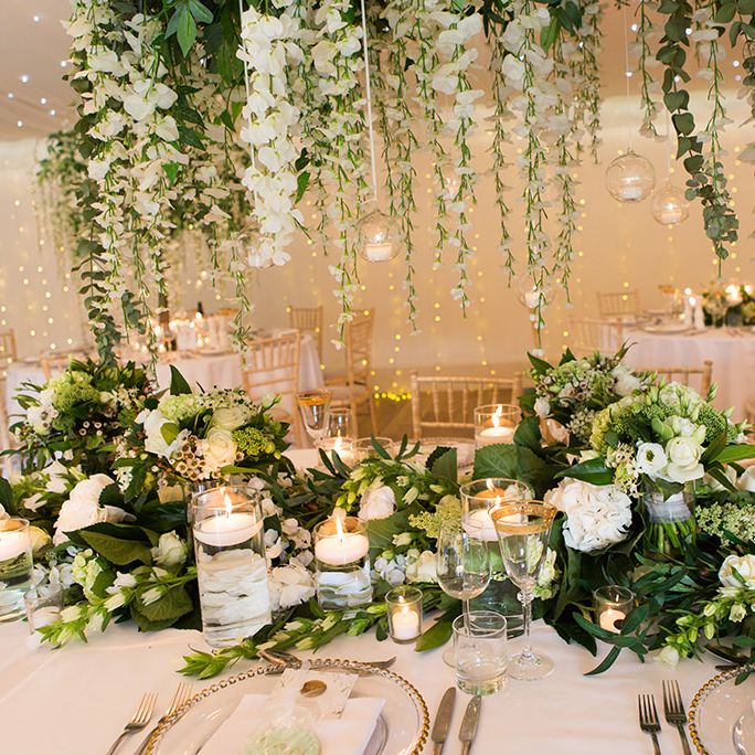 White Wedding Flowers and Foliage Table Decor with Candles