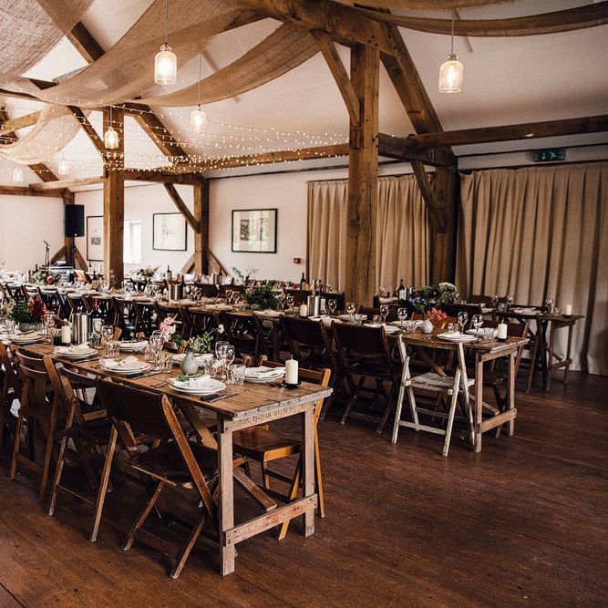 Barn wedding table set up with fairy lights