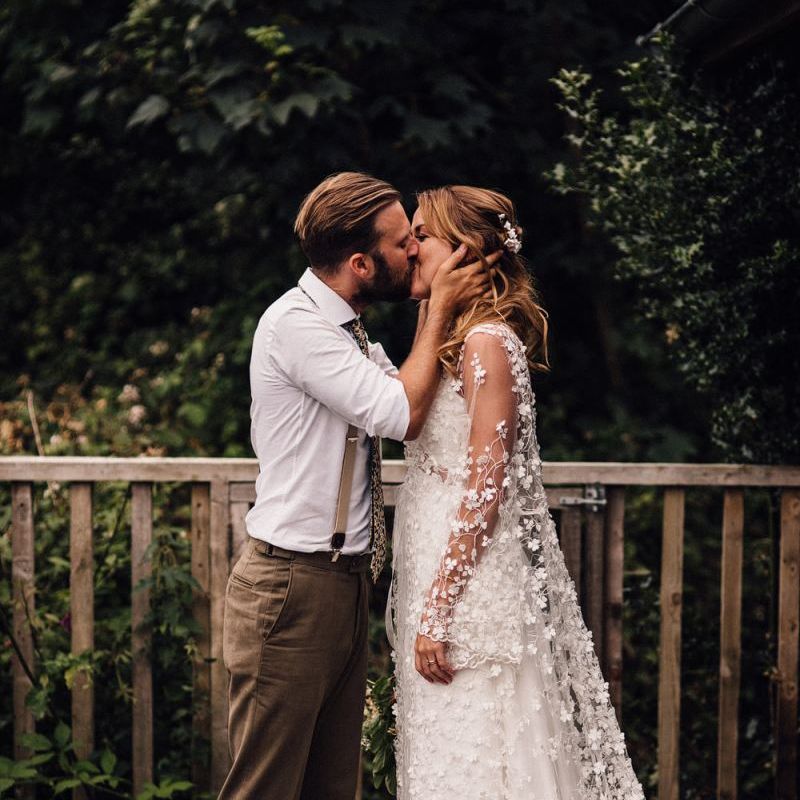 Bride in two layer bride dress with appliqué detail