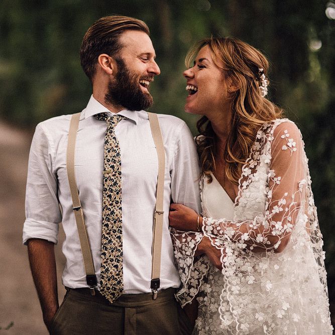 Groom wears braces and floral tie
