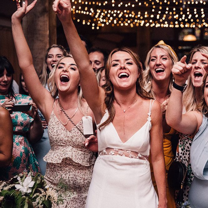 Bride with guests enjoying wedding entertainment