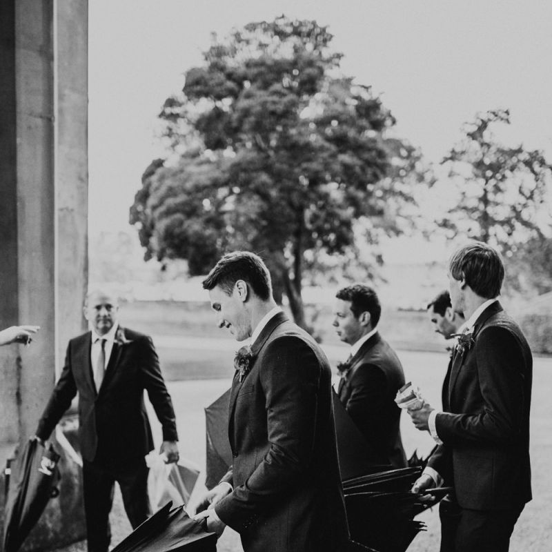 Groomsmen Holding Umbrellas