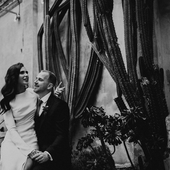 Bride Sitting on The Grooms Knee Talking