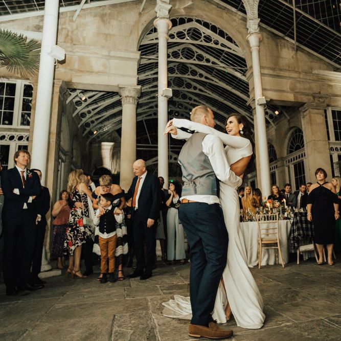 Bride and Groom Embracing During Their First Dance