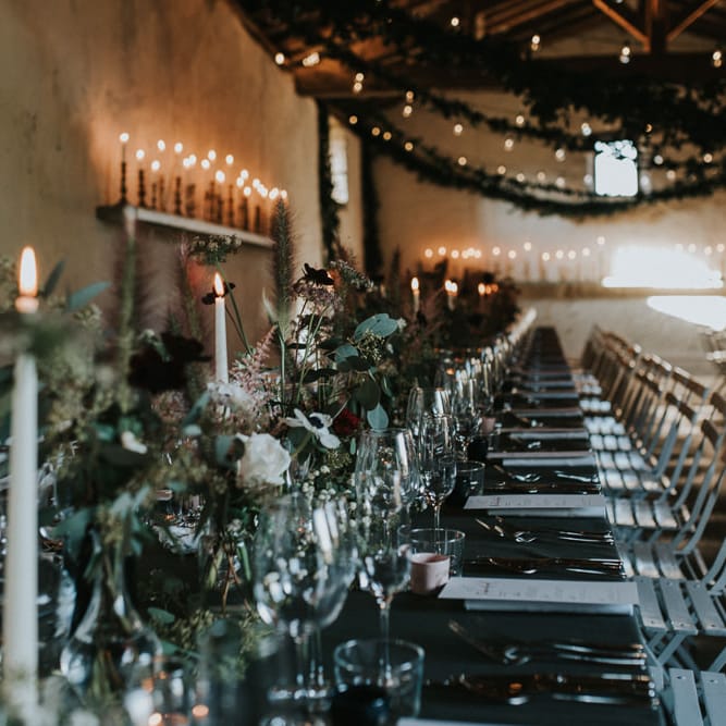 Atmospheric Wedding Reception With Candles And Bud Vase Floral Arrangements
